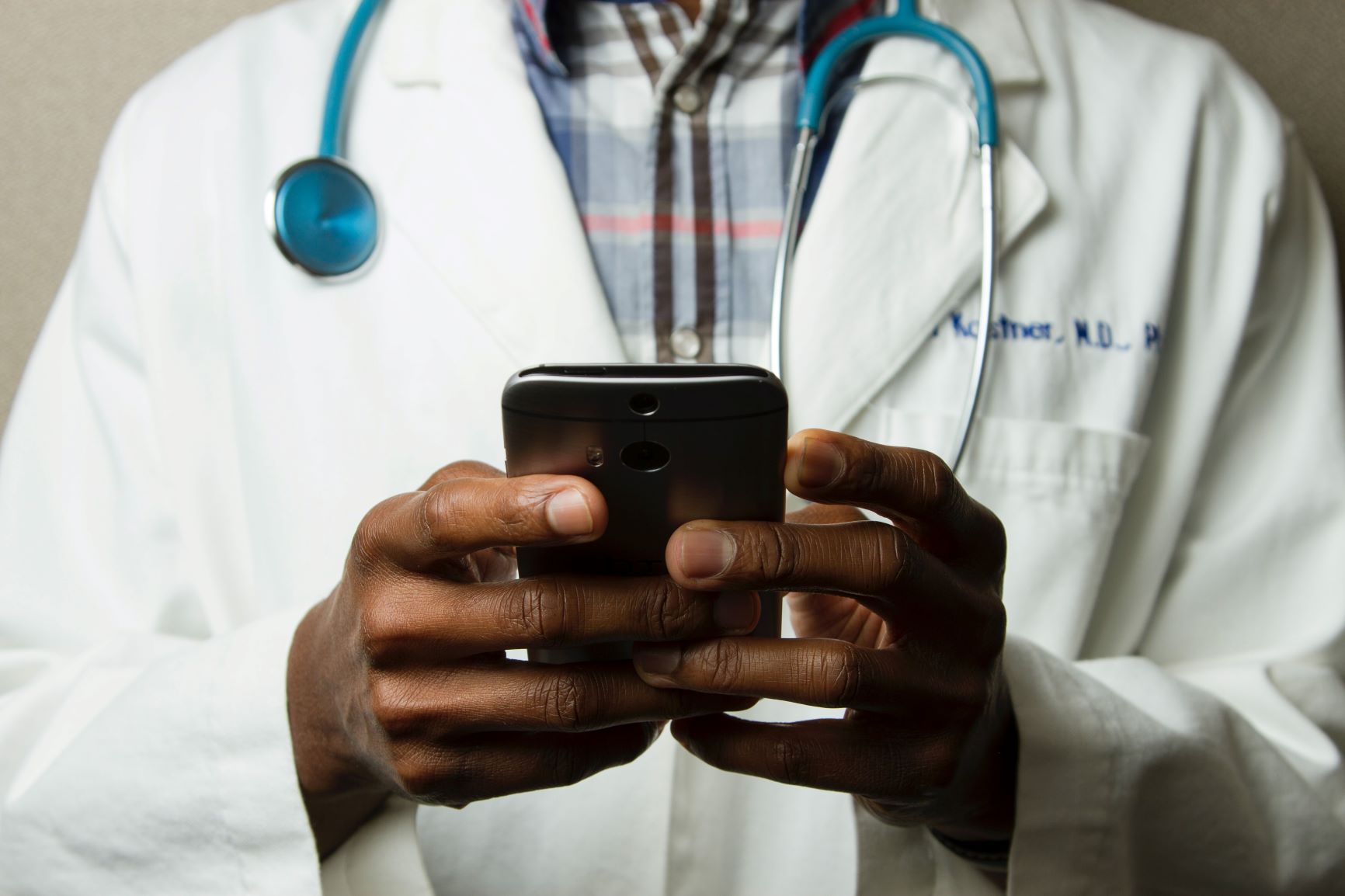 Happy doctors happy patients - doctor on phone